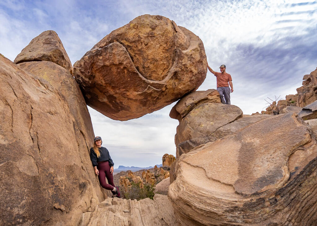 Couple standing near the Balanced Rock along the Balanced Rock Trail in Big Bend National Park in Texas