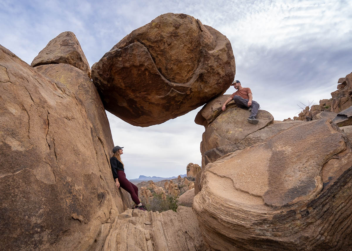 Couple standing near the Balanced Rock along the Balanced Rock Trail in Big Bend National Park