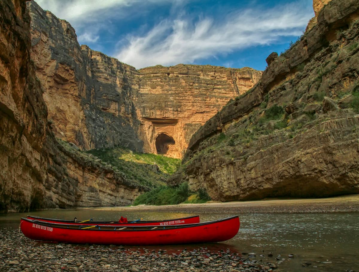 Two canoes sitting on the banks of the Rio Grande with the Santa Elena Canyon in the background in Big Bend National Park