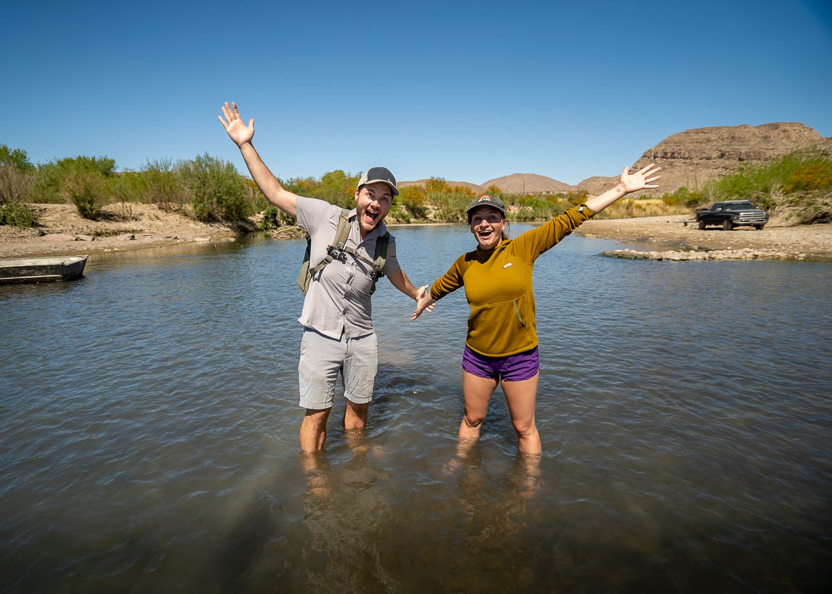 Couple standing in the Rio Grande between Big Bend National Park and Boquillas del Carmen, Mexico