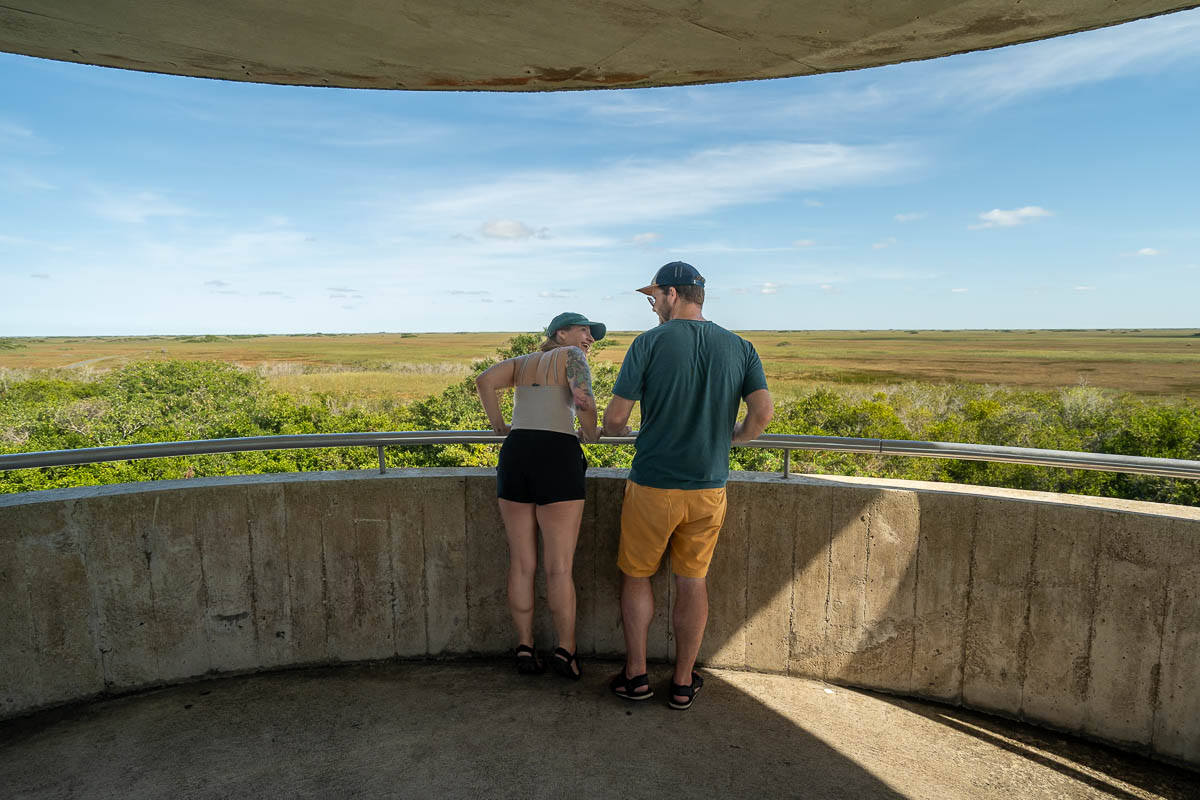 Couple looking over the sawgrass prairie from the Shark Valley Lookout Tower in Shark Valley in Everglades National Park