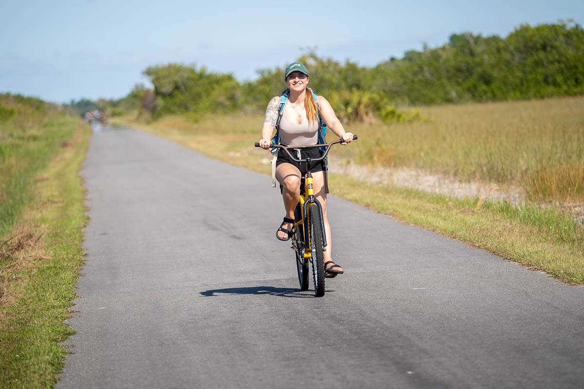 Woman biking along the Shark Valley Bike Trail in Shark Valley in the Everlades National Park