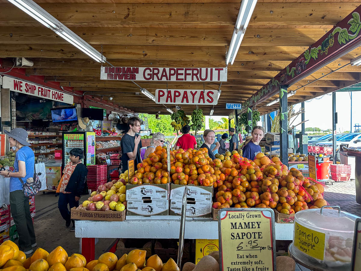 People shopping for fruit at the Robert is Here fruit stand in Homestead, Florida