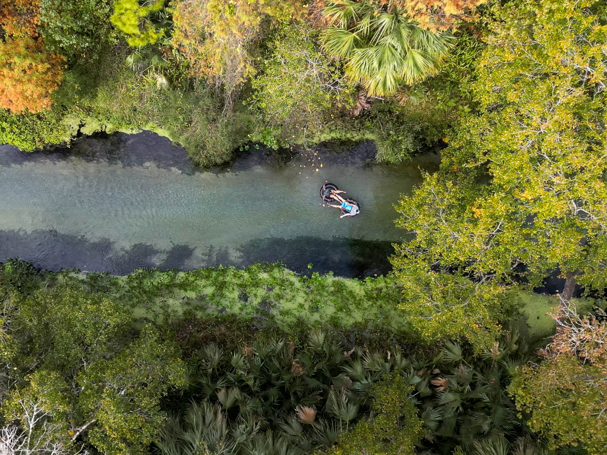 Aerial view of couple floating down Kelly Springs Rock Run in Apopka, Florida