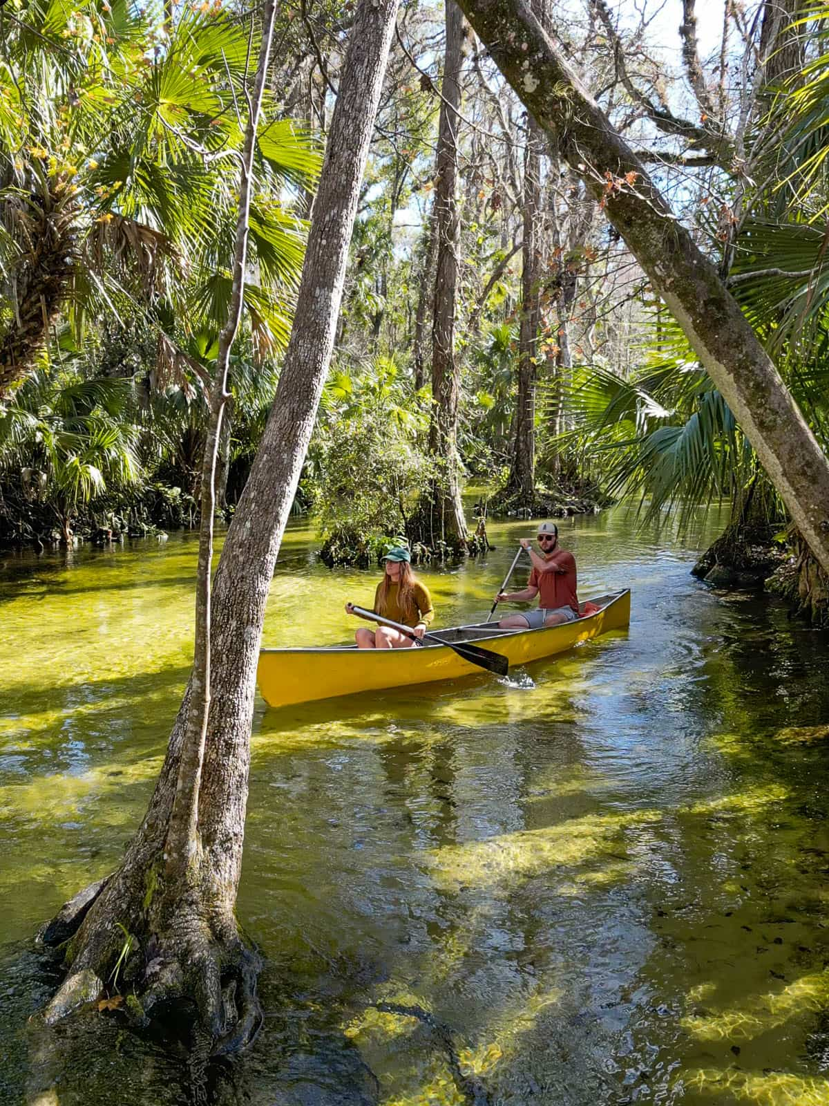 Couple kayaking in a canoe through Emerald Cut in King's Landing in Apopka, Florida