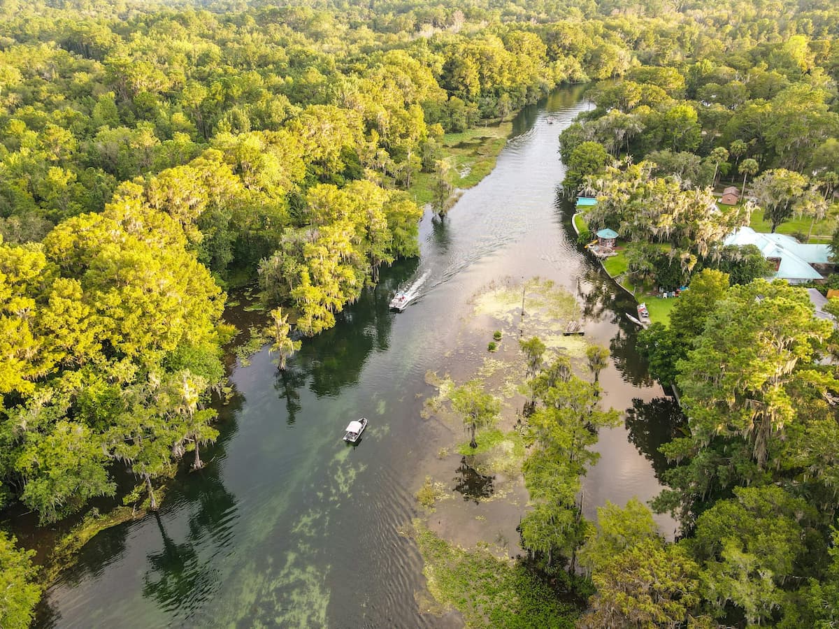 Aerial view of boats cruising along the Three Sisters Spring in Apopka, Florida