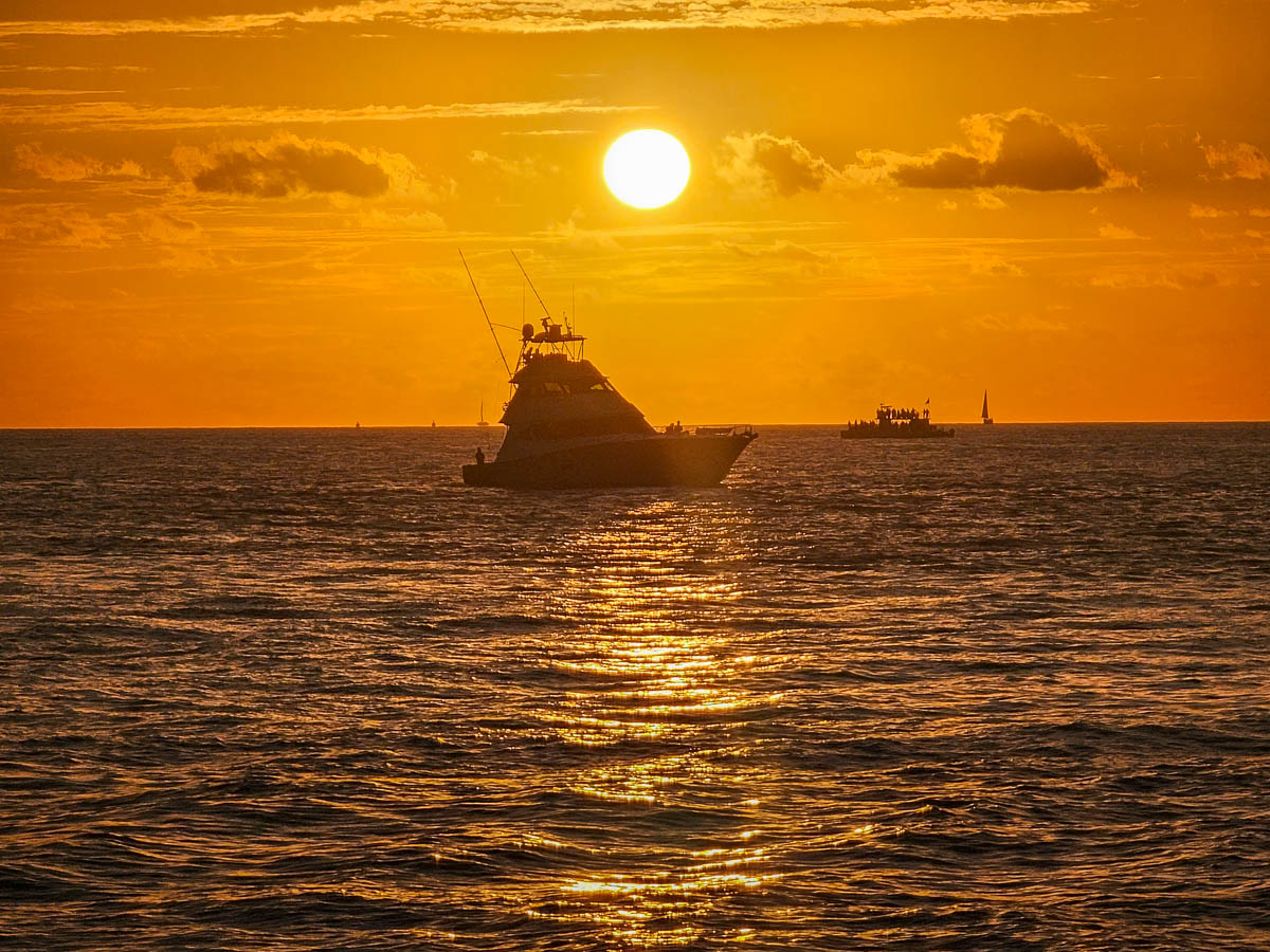 Sunset over a boat from Mallory Square in Key West, Florida