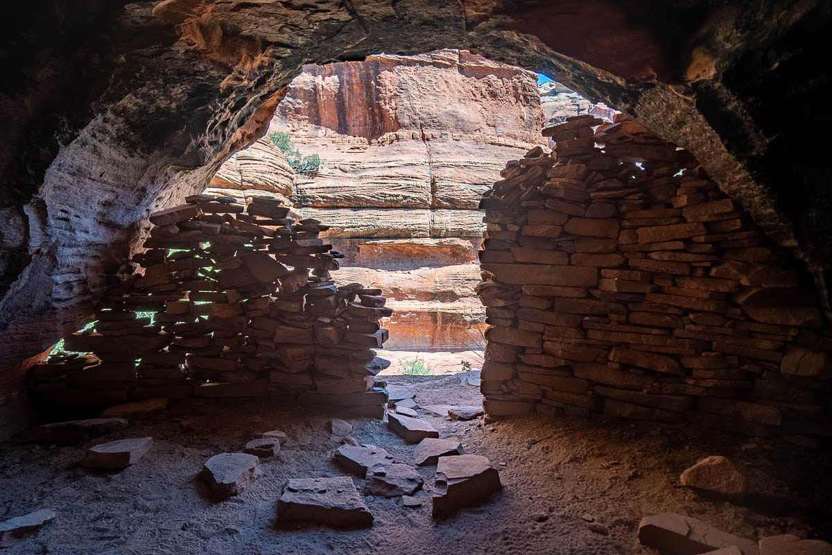 Ruins near the Subway Cave with a rock formation in the background in Sedona, Arizona