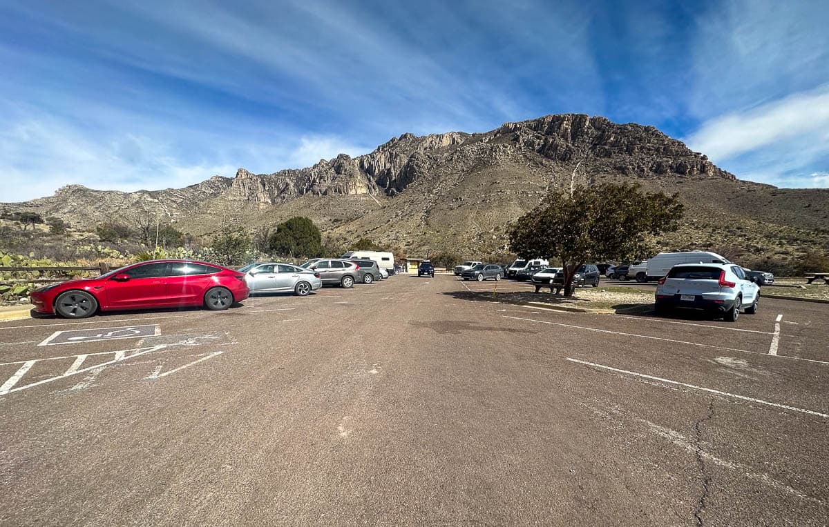 Parking lot with mountains in the background for the Devil's Hall Trail in Guadalupe Mountains National Park in Texas