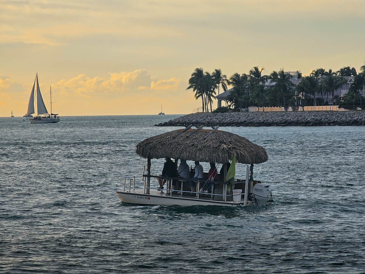 Tiki boat cruising around Sunset Key and Key West Harbor in Key West in the Florida Keys