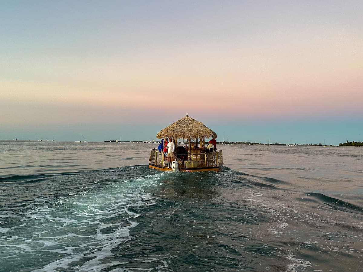 Floating tiki boat at sunset in Key West in the Florida Keys, Florida