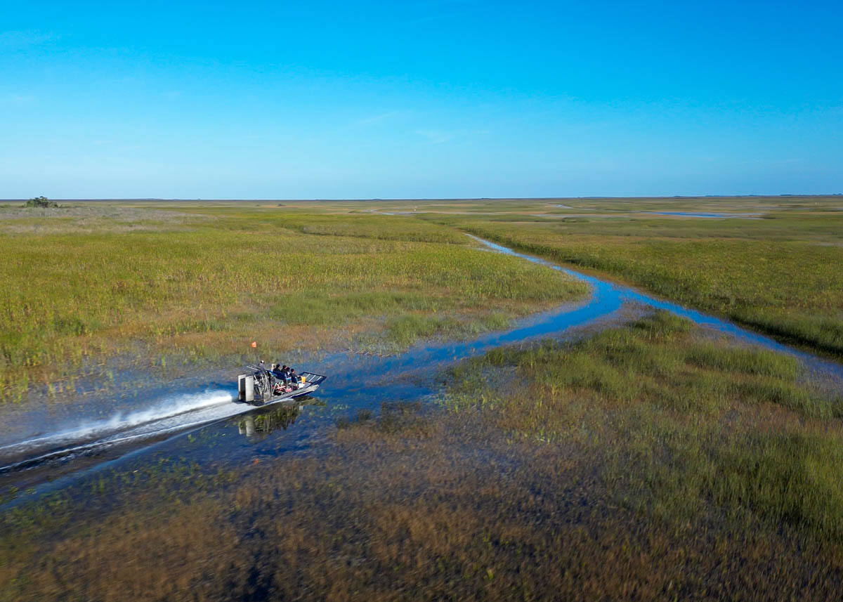 Airboat cruising through wetlands in Everglades National Park in Florida