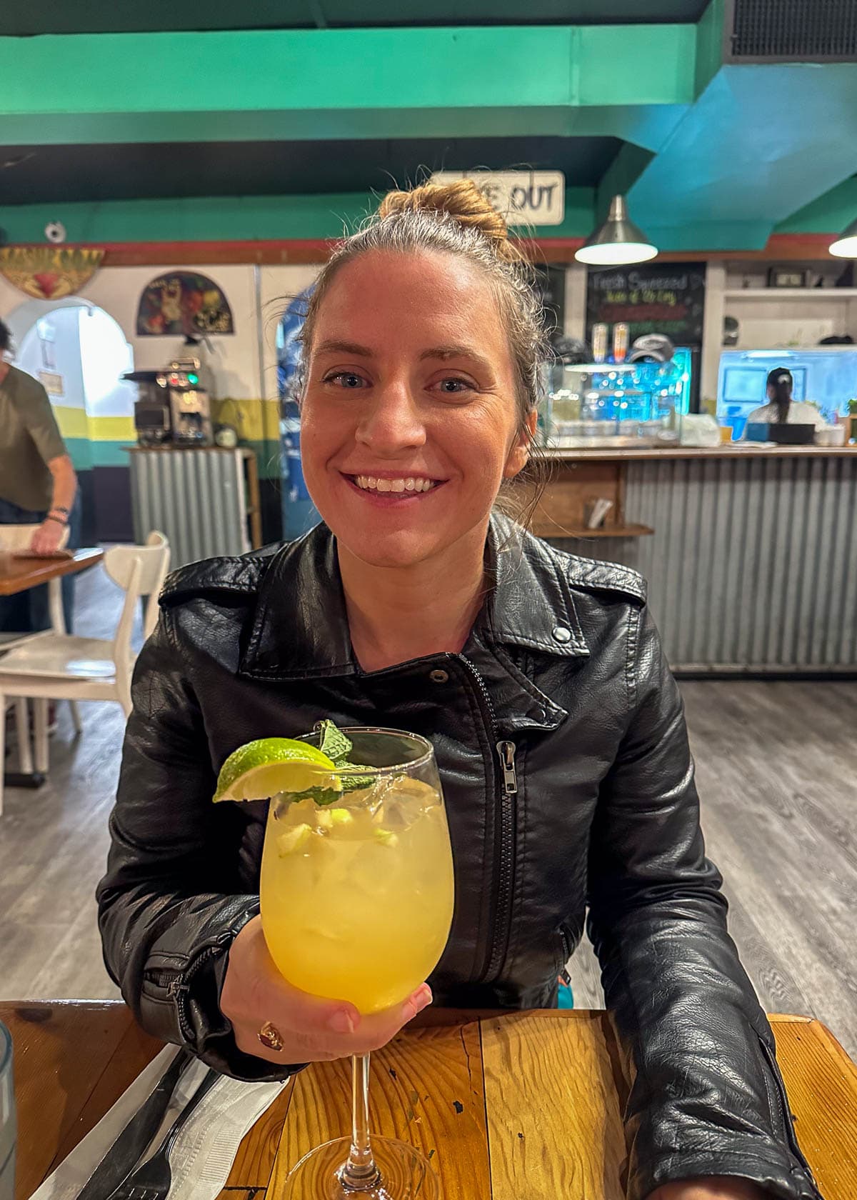 Woman holding a glass of key lime sangria at The Cafe in Key West in the Florida Keys in Florida