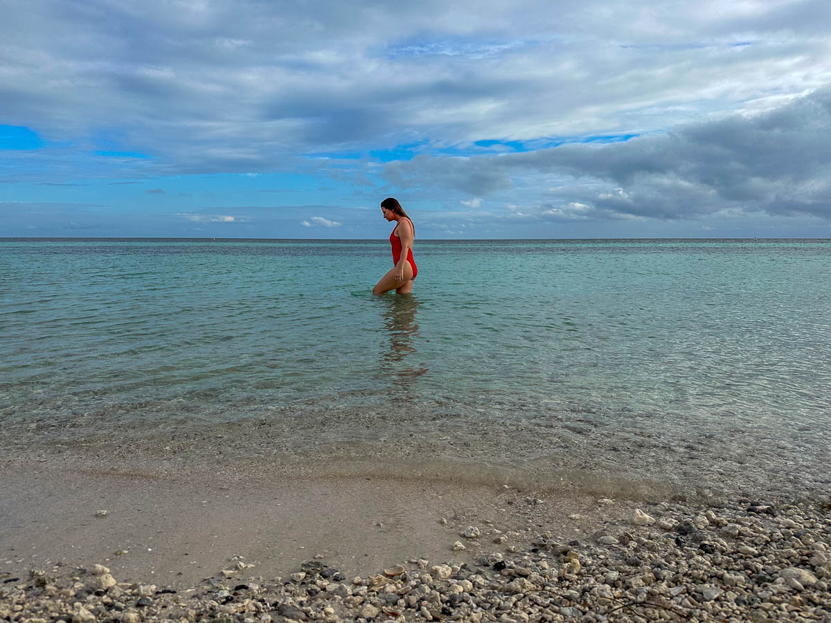 Woman walking through the water at Bahia Honda State Park on Big Pine Key in the Florida Keys, Florida