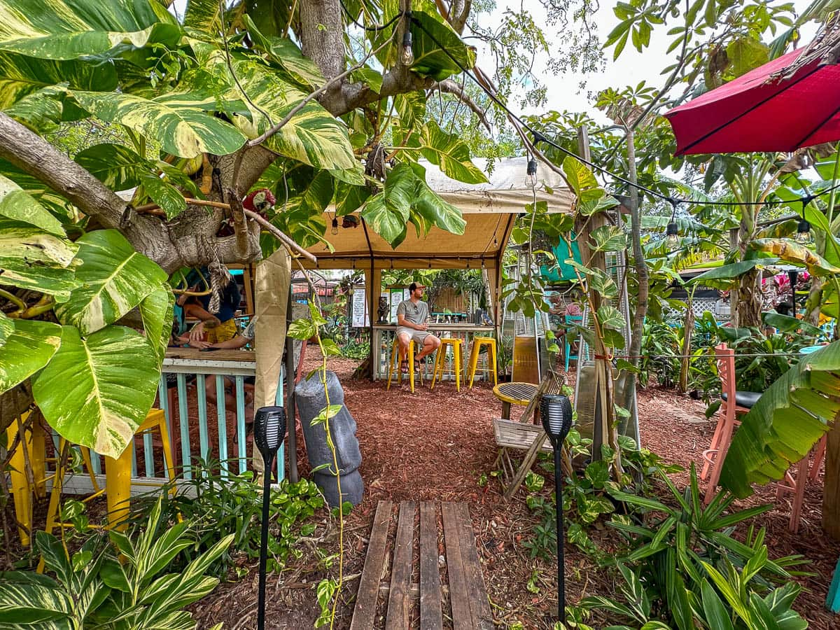 Man sitting in an outdoor seating area at Irie Island Eats in Marathon on the Florida Keys in Florida