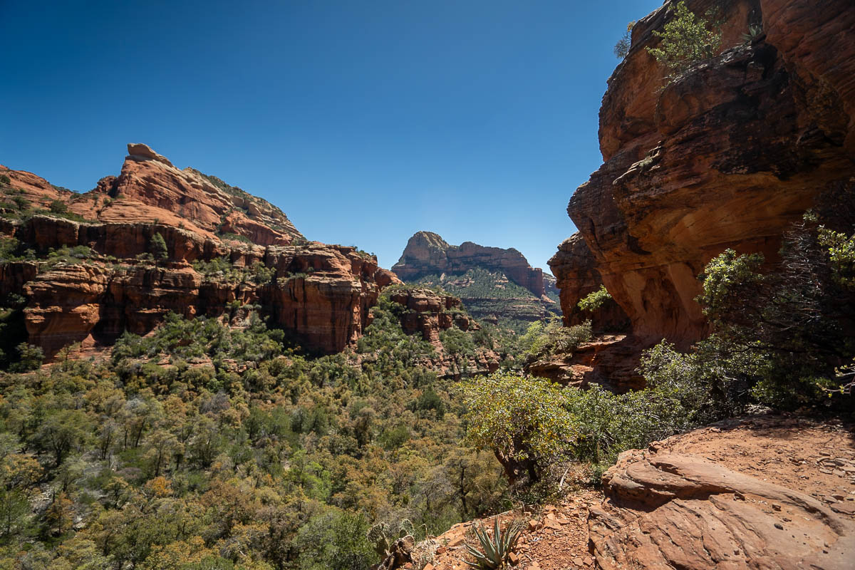 View from the ledge of the Subway Cave with rock formations in the background in Sedona, Arizona