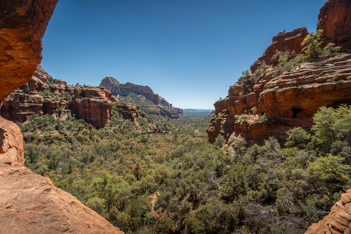 View of red rock formations from the ledge of the Subway Cave in Sedona, Arizona