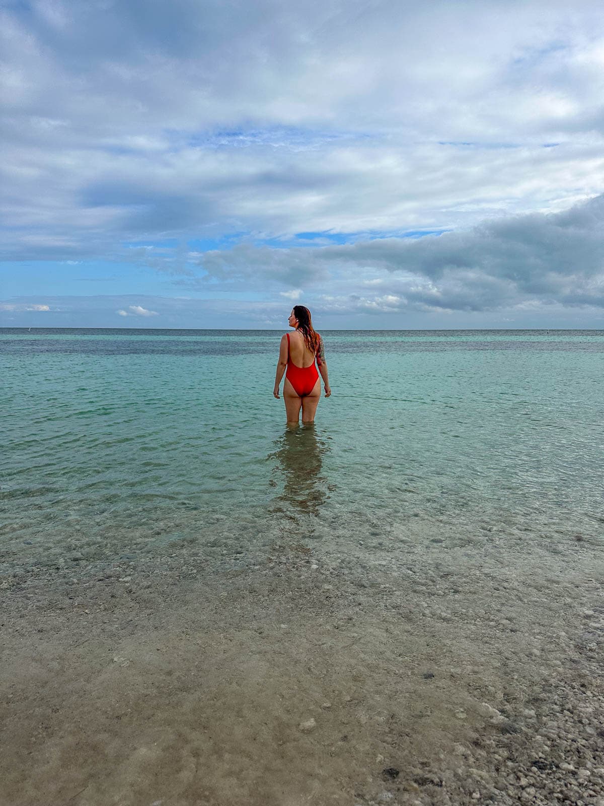 Woman walking in the water in Bahia Honda State Park in Big Pine Key in the Florida Keys