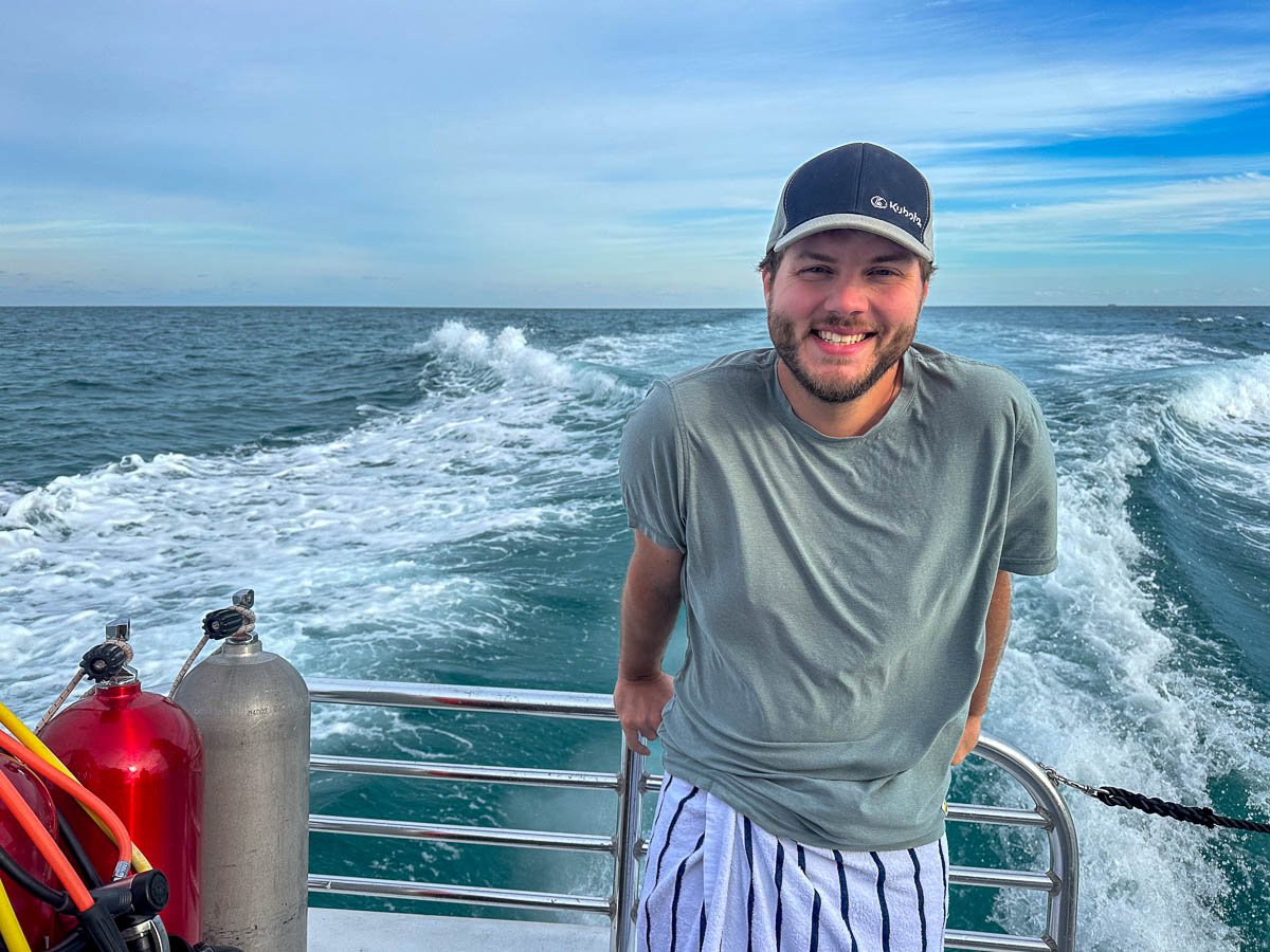 Man smiling on a scuba dive boat in John Pennekamp Coral Reef State Park in Key Largo in the Florida Keys