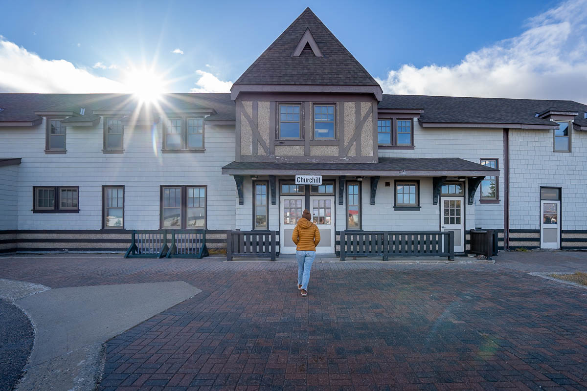 Woman walking toward a train station in Churchill, Manitoba