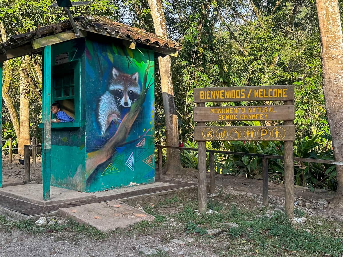 Boy sitting in a ticket office for Semuc Champey in Guatemala