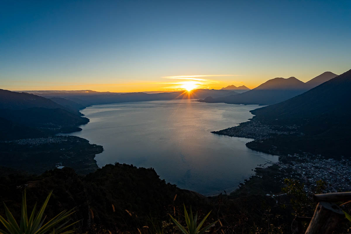 Sun eclipsing a mountain in Lake Atitlan, Guatemala