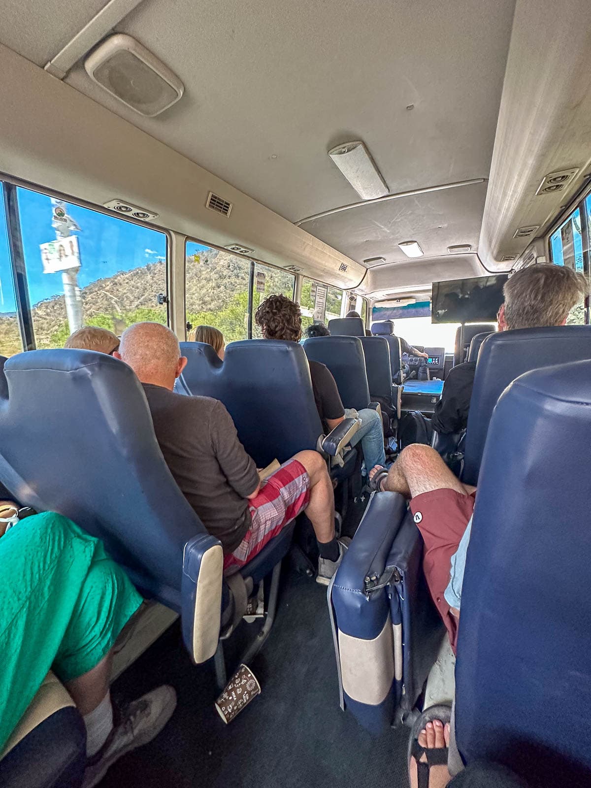 People sitting on a shuttle to Flores, Guatemala