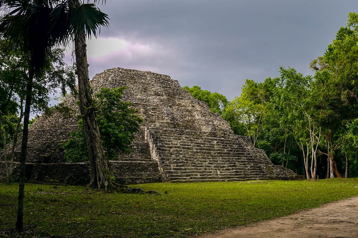 Pyramid surrounded by jungle at Yaxha Ruins in Guatemala 