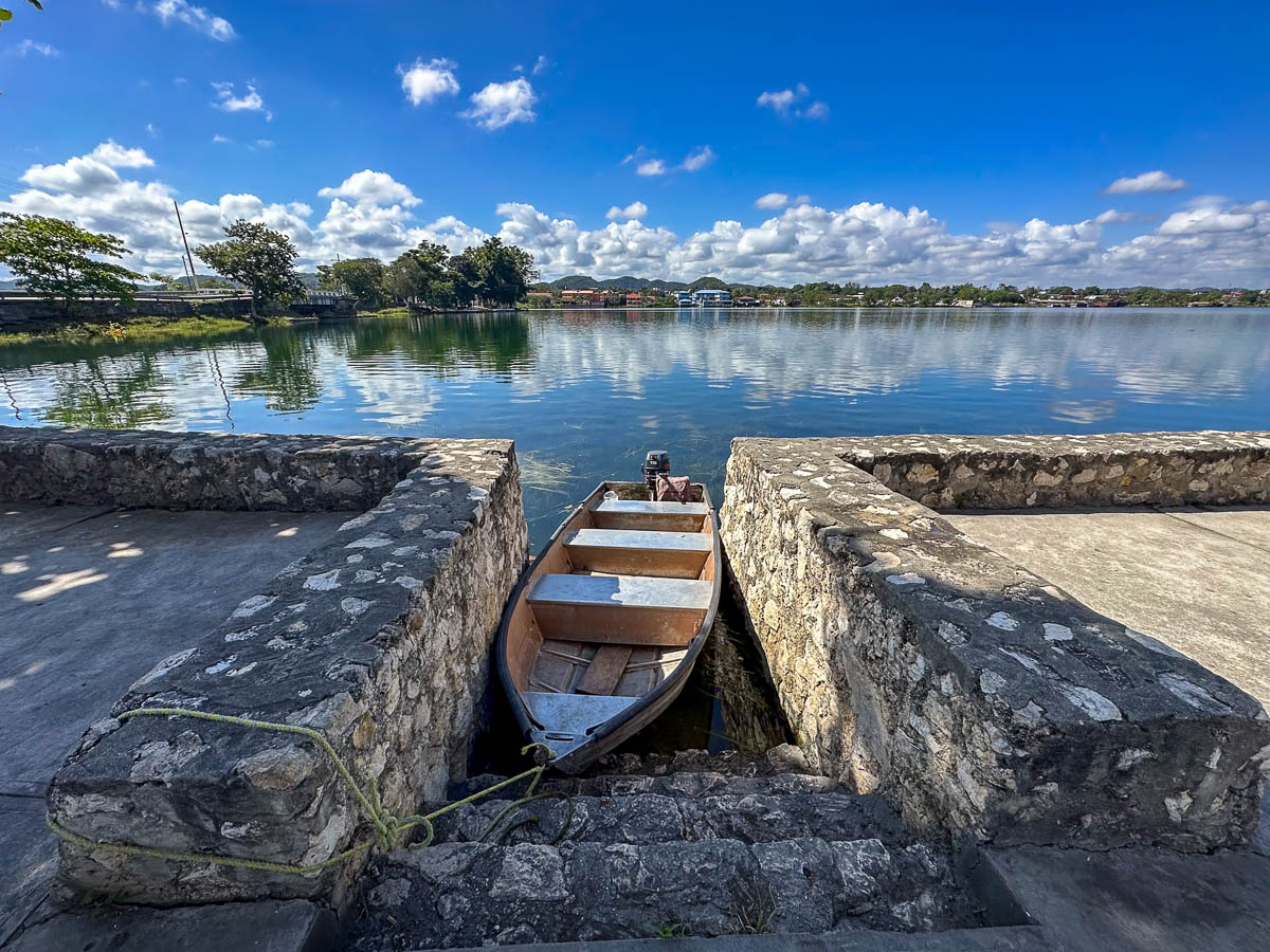 Wooden boat parked along Lake Peten in Flores, Guatemala