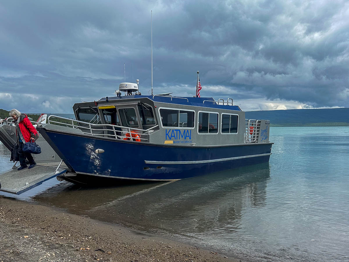 Water taxi for Katmai Water Taxi parked on the beach of Naknek Lake in Katmai National Park in Alaska