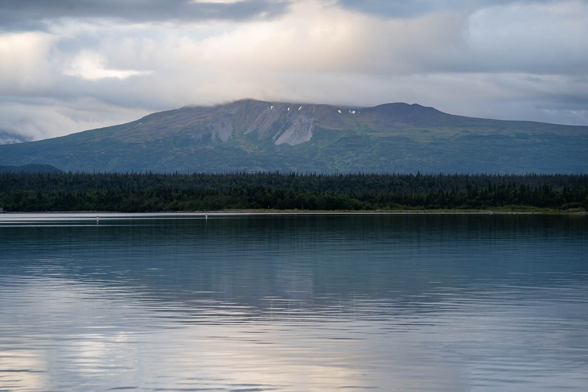 Mountain over pine trees and Naknek Lake in Katmai National Park in Alaska