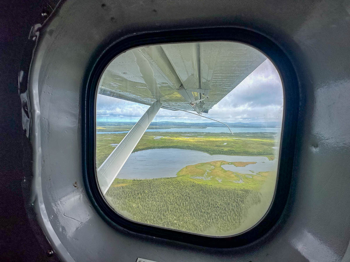 View from a window of a floatplane over a lake in Katmai National Park in Alaska