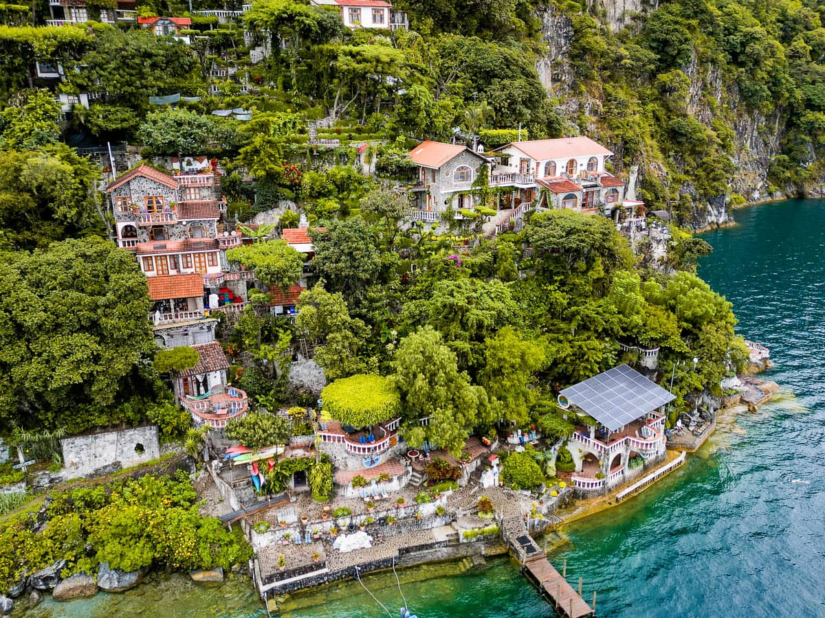 Aerial view of Casa del Mundo built into a cliffside in Lake Atitlan, Guatemala