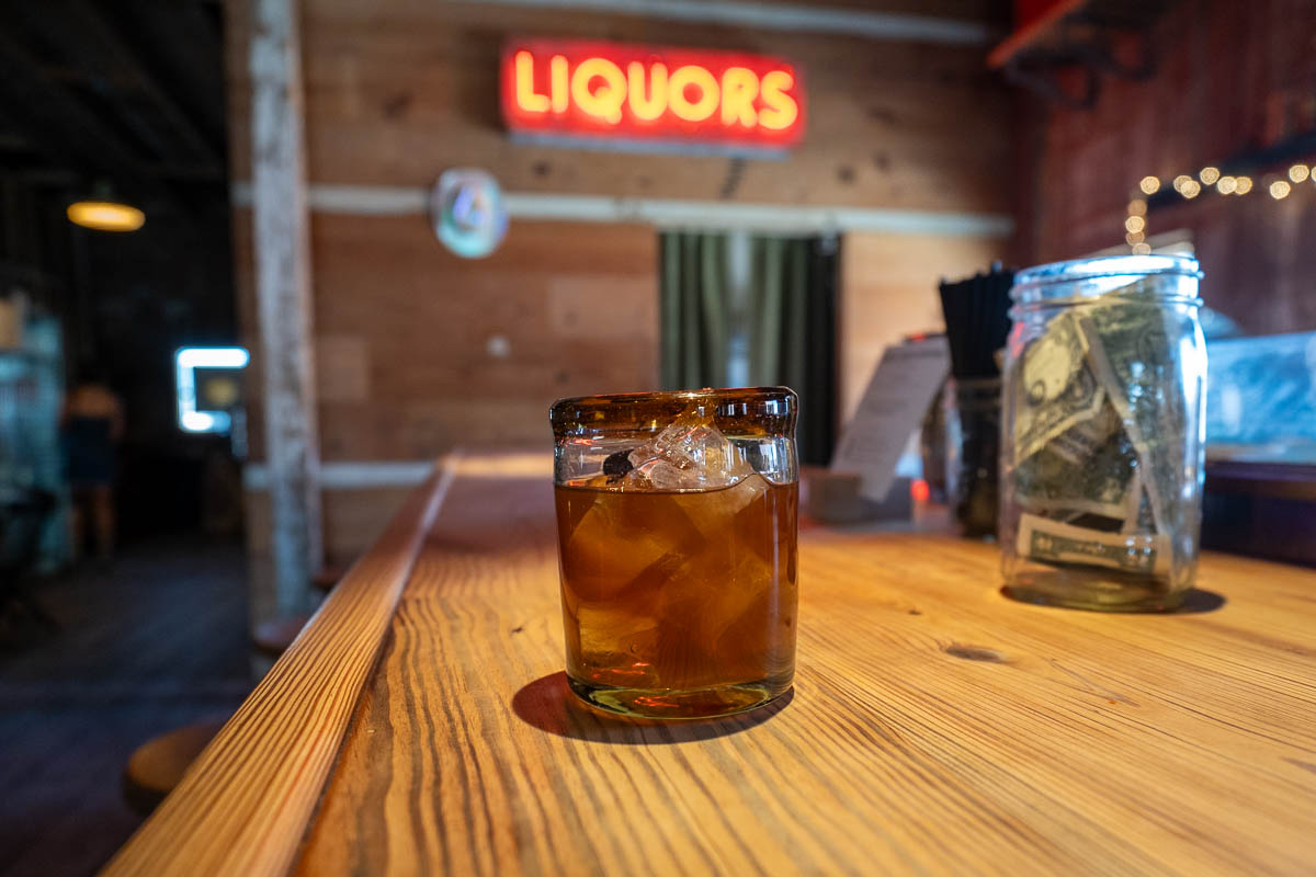 Old fashioned with sotol on a counter at the Marfa Spriit Co. at Marfa, Texas