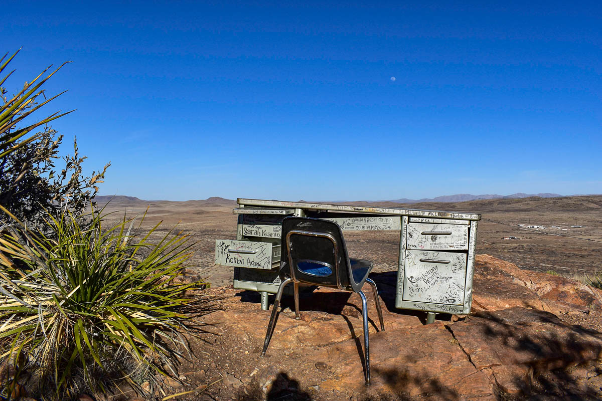 Metal desk that's covered with signatures on a hill along the Hancock Trail in Alpine, Texas