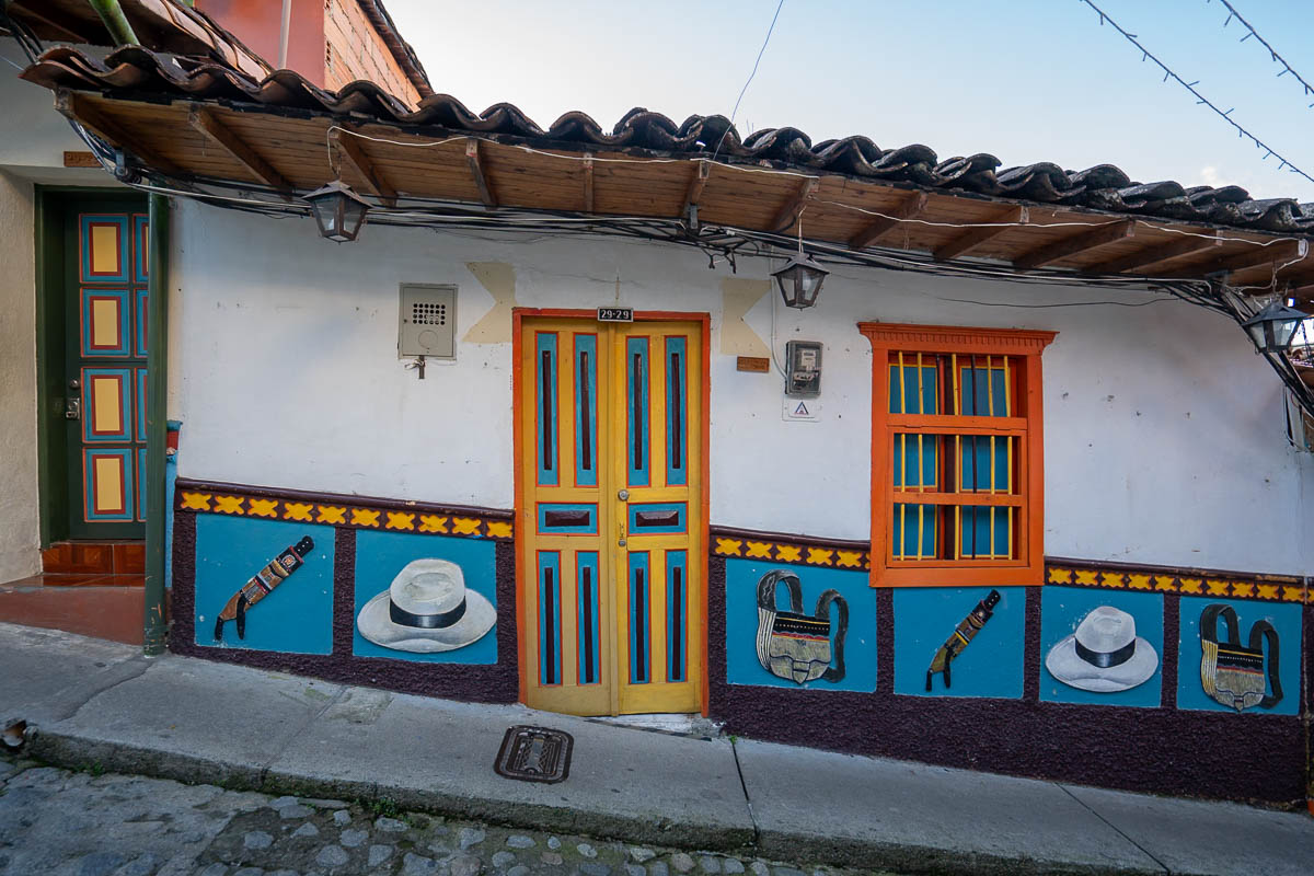 Colorful street with zócalo along a cobblestone street in Guatape, Colombia