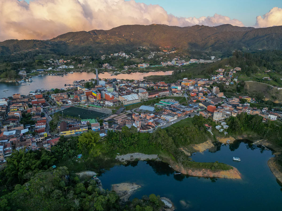 Aerial view of colorful buildings and mountains in Guatape, Colombia