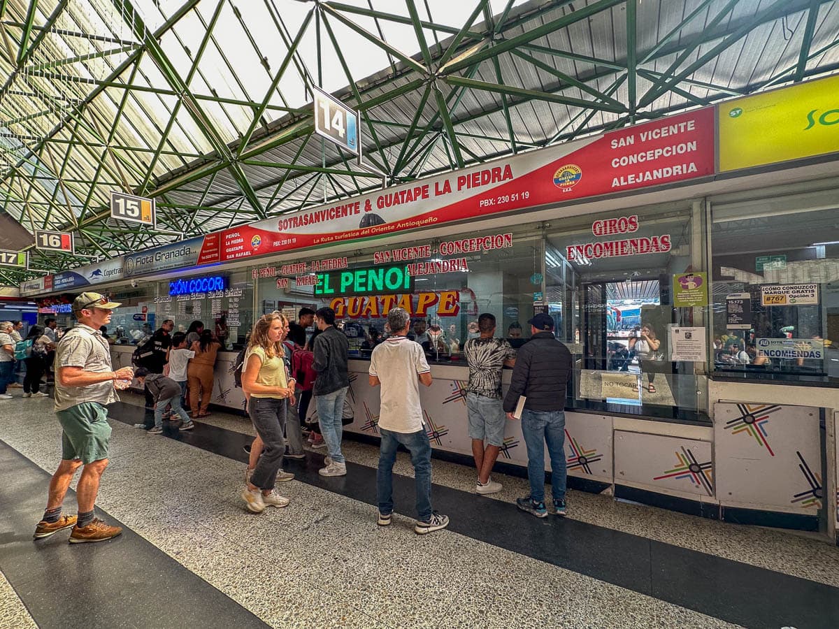 People standing in line for bus tickets at Terminal del Norte in Medellin, Colombia