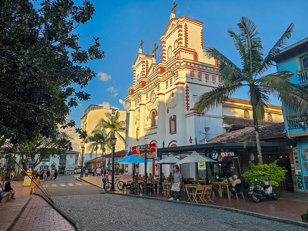 Cafe and church near the town square in Guatape, Colombia