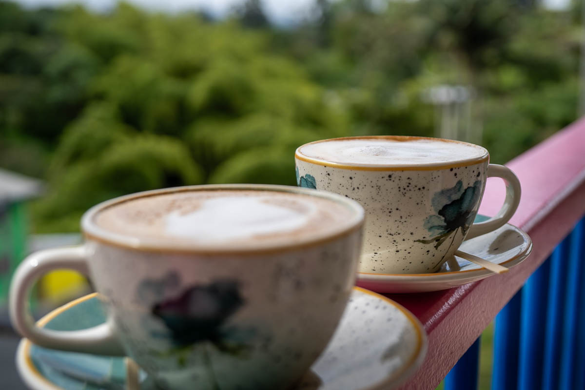 Two lattes on a colorful banister in Salento, Colombia