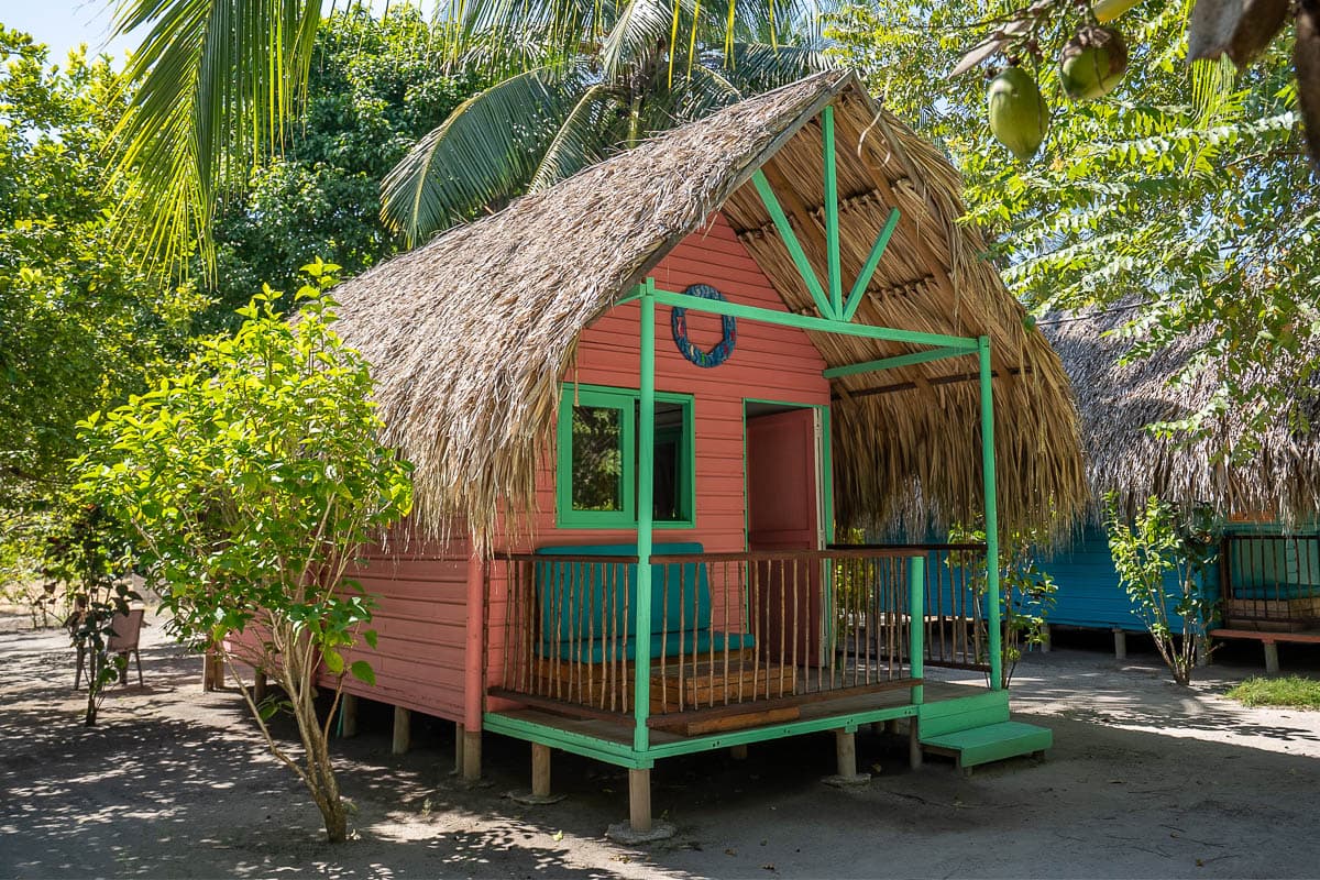 Colorful thatched roof cabin at Eco Hotel Las Casitas de Mar Adentro on Isla Grande in Colombia