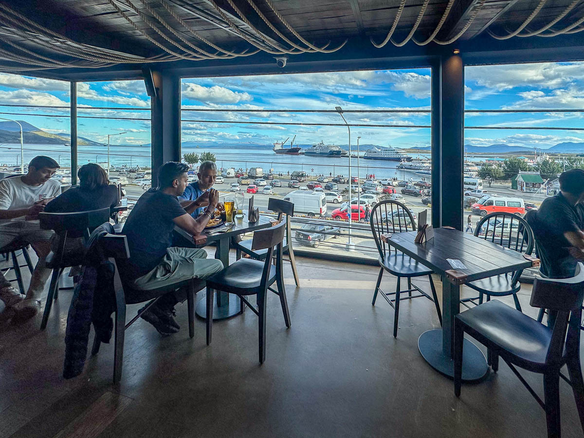 View of the second floor windows in Patagonia Brewery with the Ushuaia port in the background in Ushuaia, Argentina