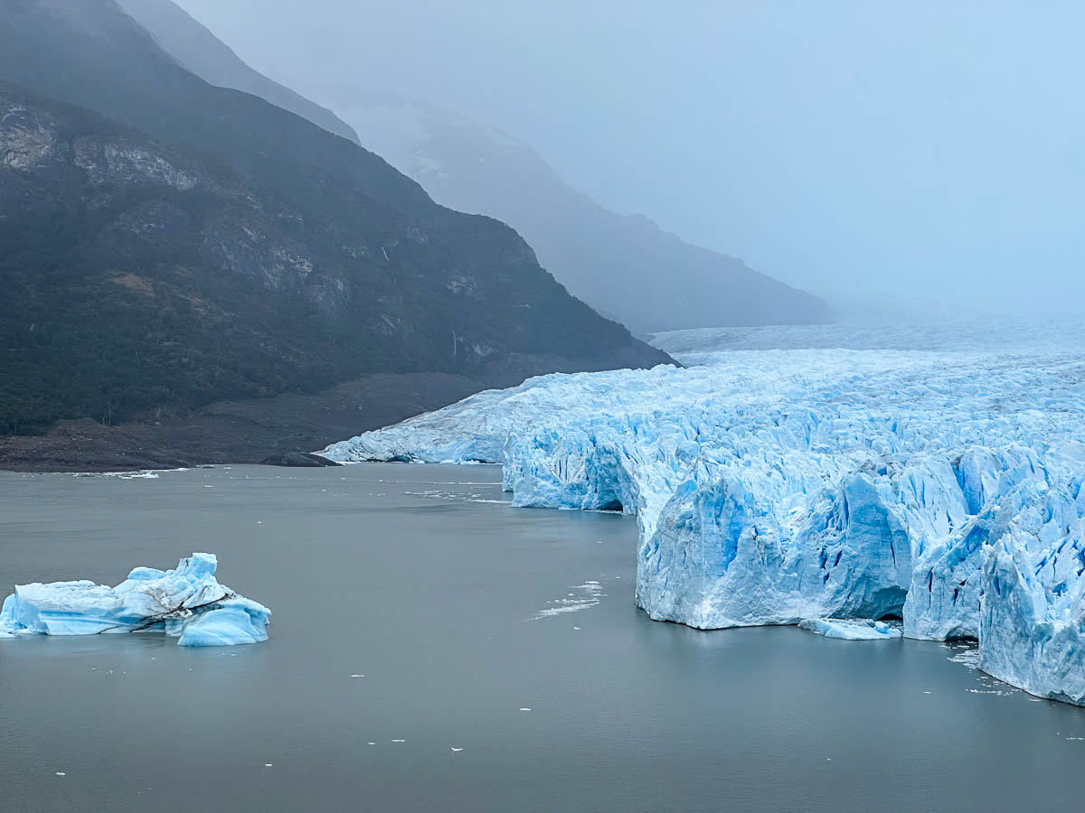 Southern face of the Perito Moreno glacier with a mountain in the background in Los Glaciares National Park near El Calafate, Argentina