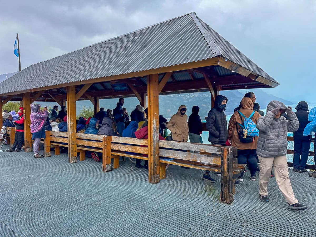 Covered benches along the Sendero Accessible trail overlooking the Perito Moreno Glacier in Los Glaciares National Park near El Calafate, Argentina