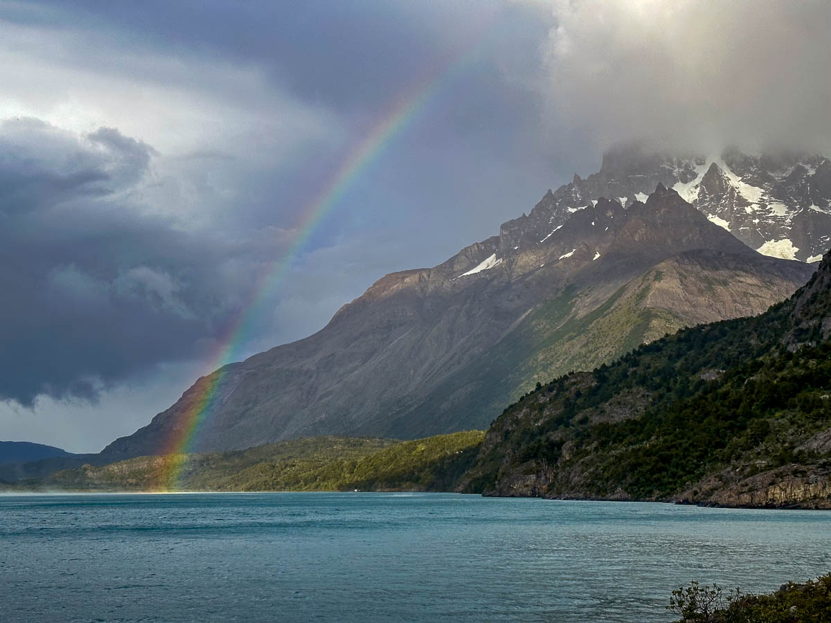 Rainbow in front of Nordenskjöld Lake and mountains along the W Trek in Torres del Paine National Park in Chilean Patagonia