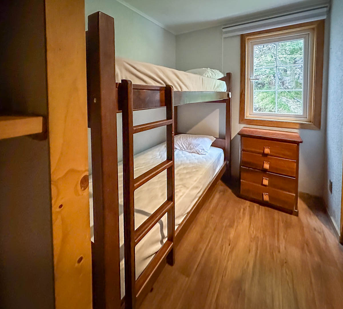 Bunk beds with a set of drawers in Refugio Grey along the W Trek in Torres del Paine National Park in Chilean Patagonia