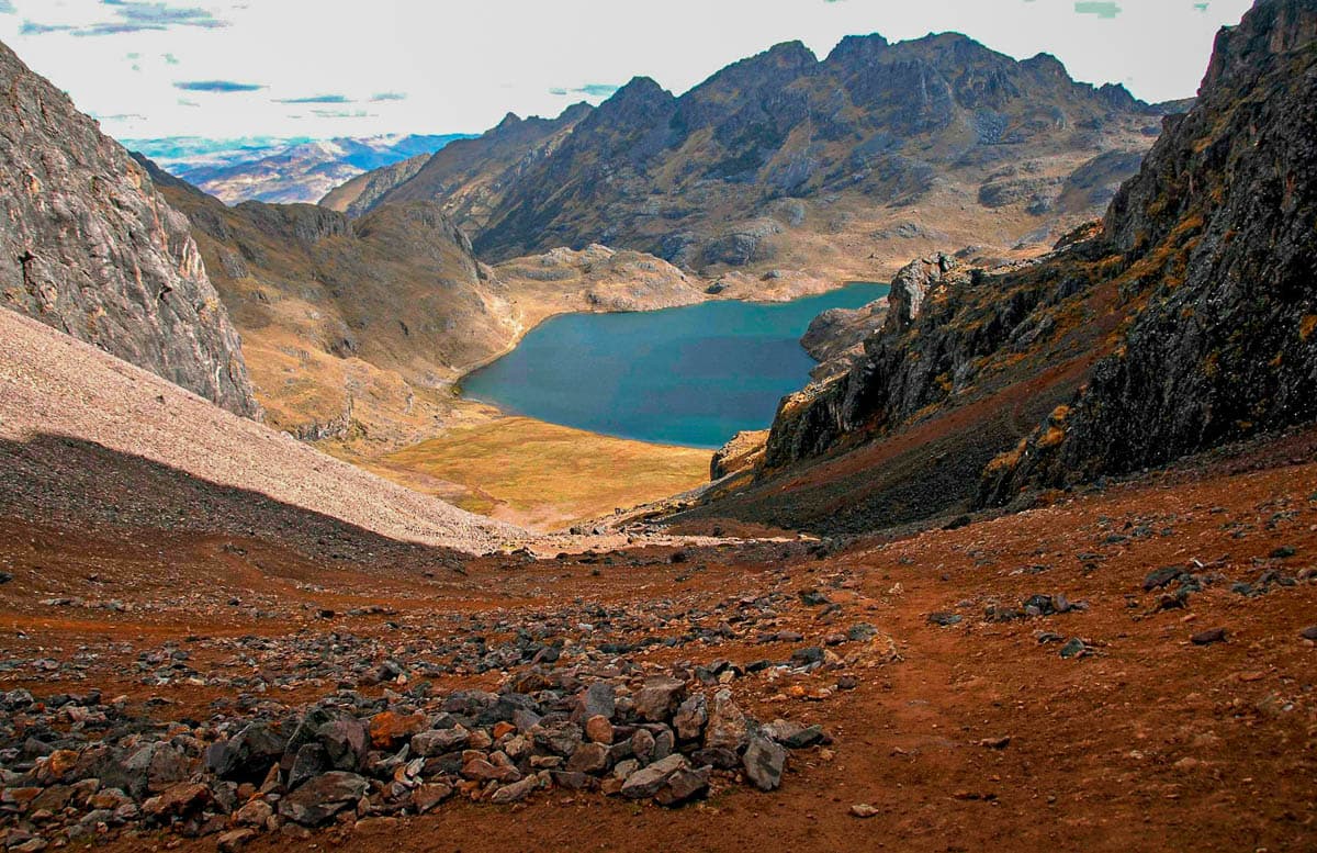 Alpine lake surrounded by the Andes Mountains along the Lares Trek in Peru