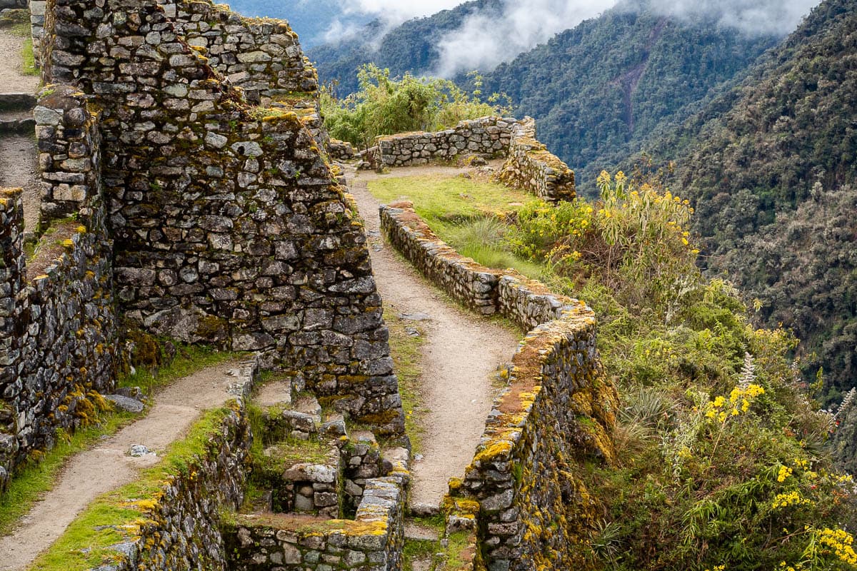 Sayacmarca ruins with mountains in the background along the Inca Trail in Peru