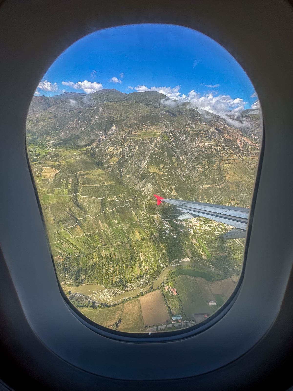 View of farmlands outside of Huaraz from an airplane window in Peru
