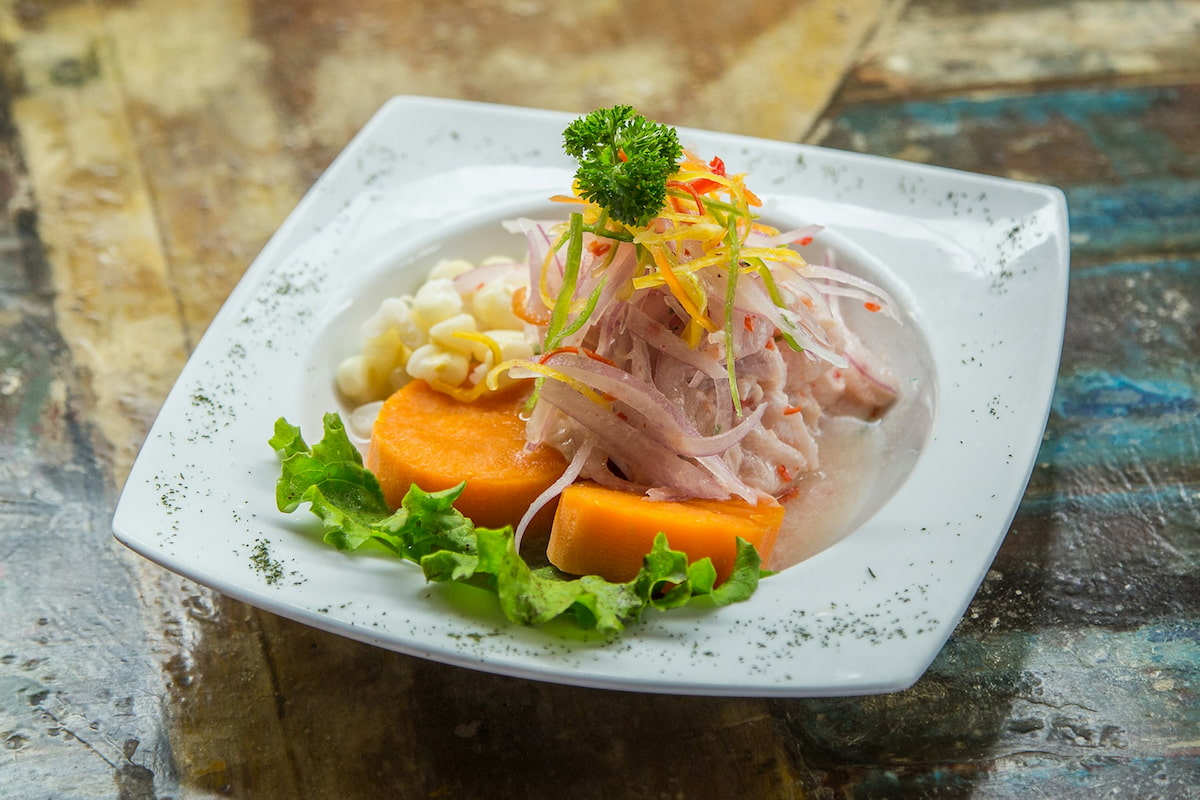Plate of ceviche on a table in Peru